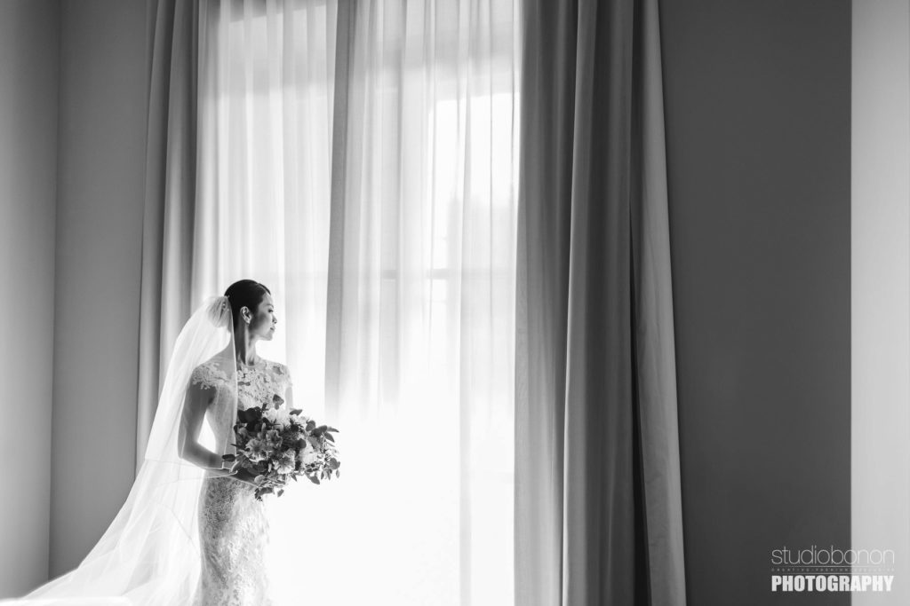 Lovely bride at Castelfalfi country resort almost ready to walks down the aisle. Tuscany countryside destination wedding.