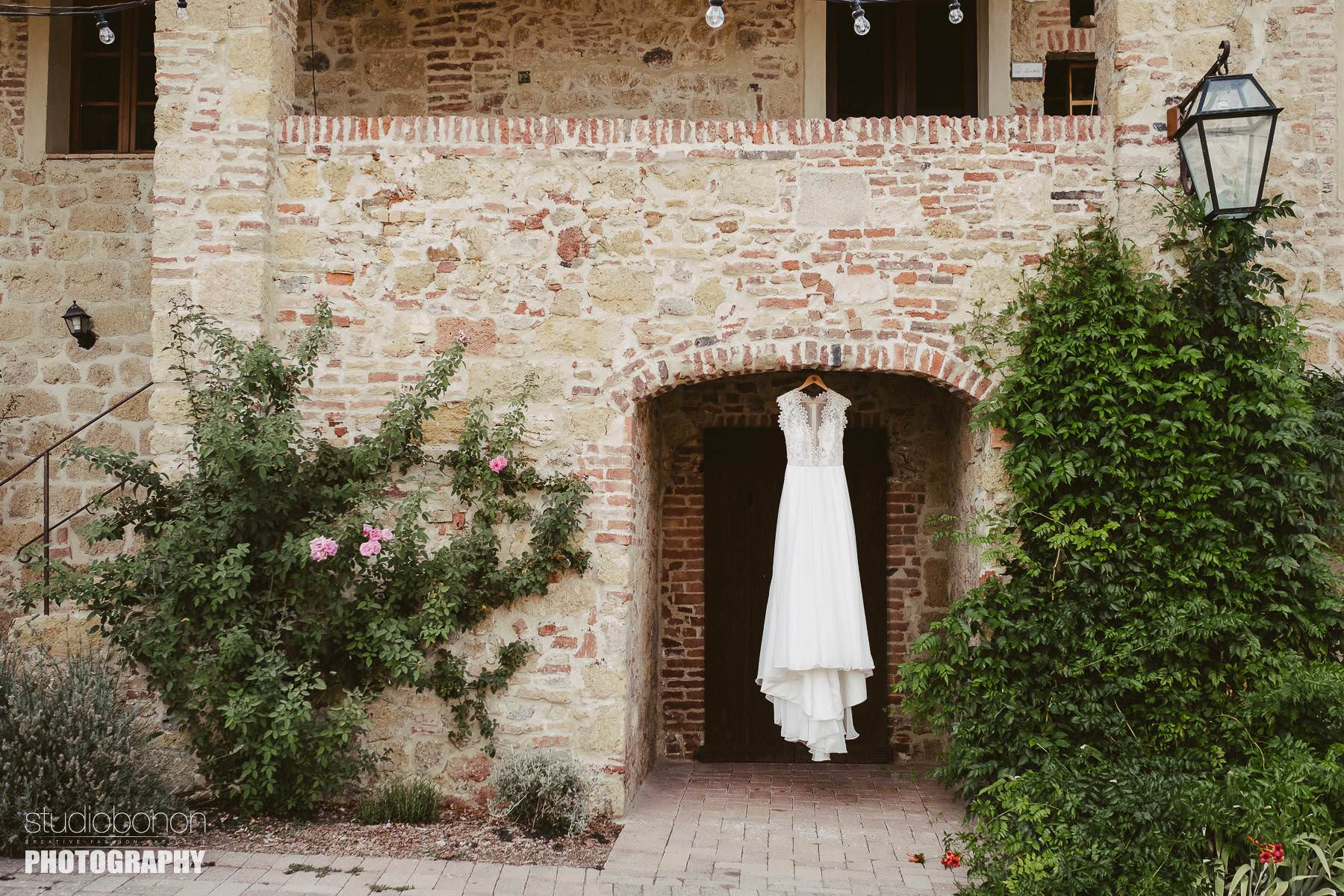 Beautiful bride white dress in a rustic Tuscany countryside villa for this intimate wedding at Tenuta di Papena and Roofless Abbey of San Galagano