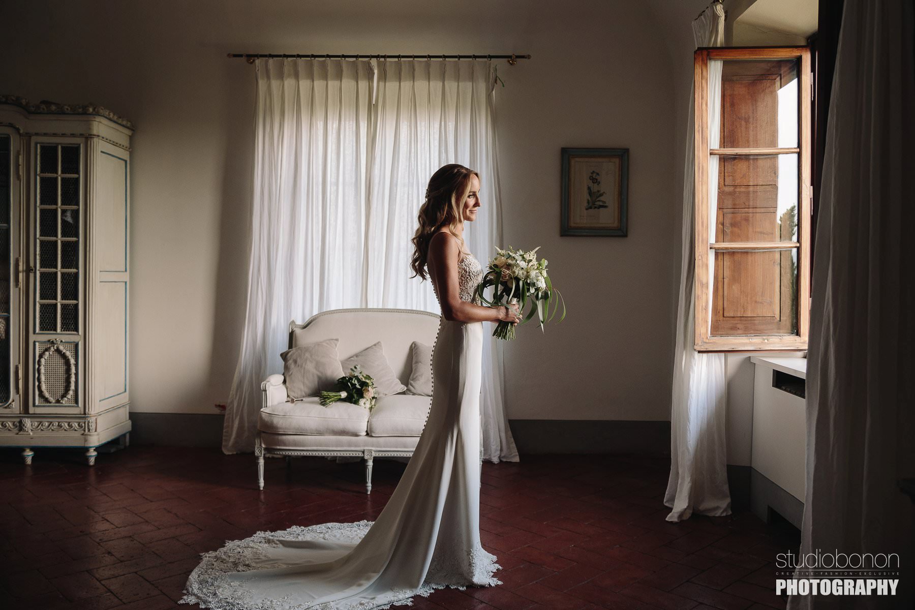 Beautiful bride in Tuscan Villa almost ready for wedding ceremony