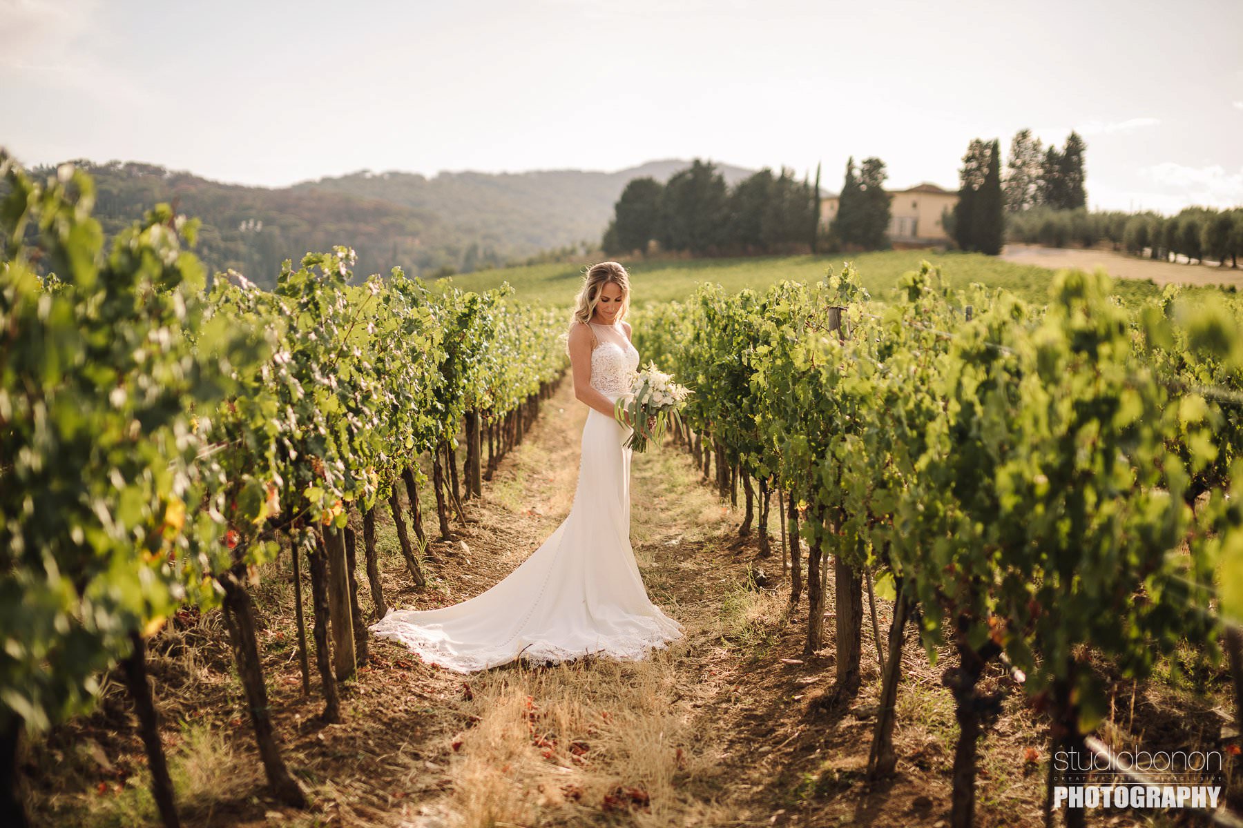 Beautiful bridal portrait into a Tuscan vineyard