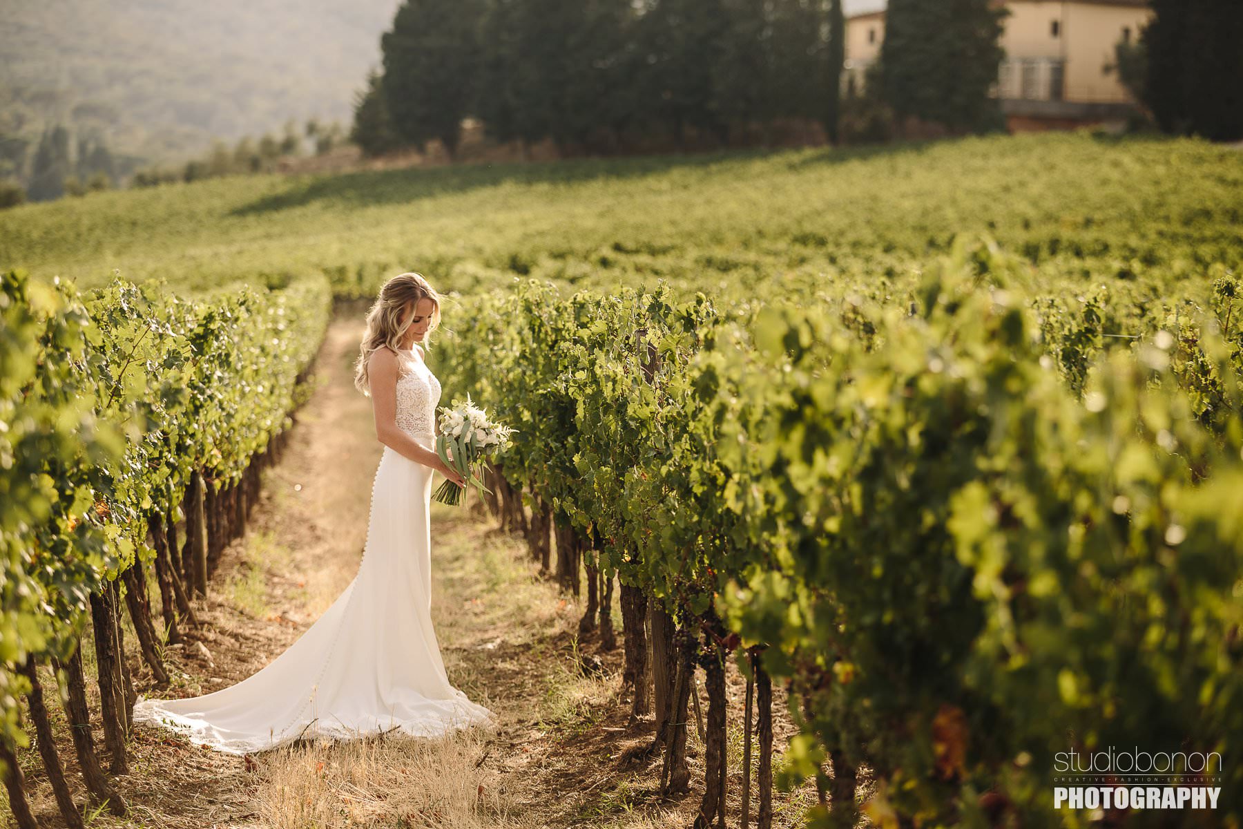 Beautiful bridal portrait into a Tuscan vineyard