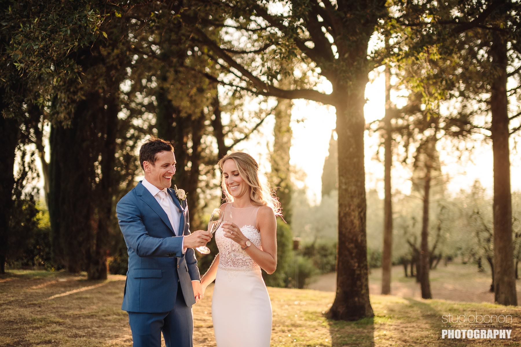 Golden hour wedding photo with bride and groom at Villa Pisignano in Chianti